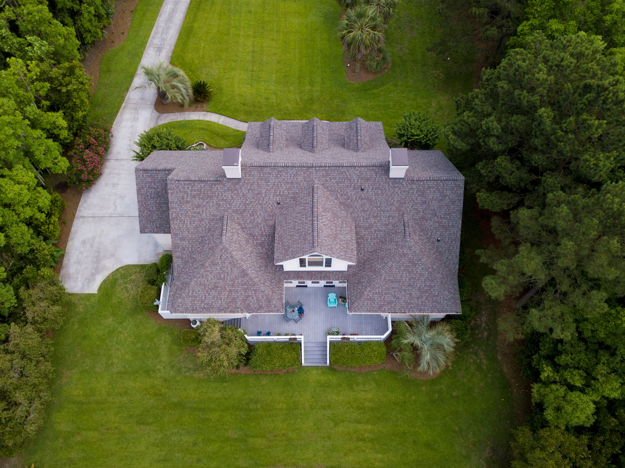 aerial view of large home with new roof installation