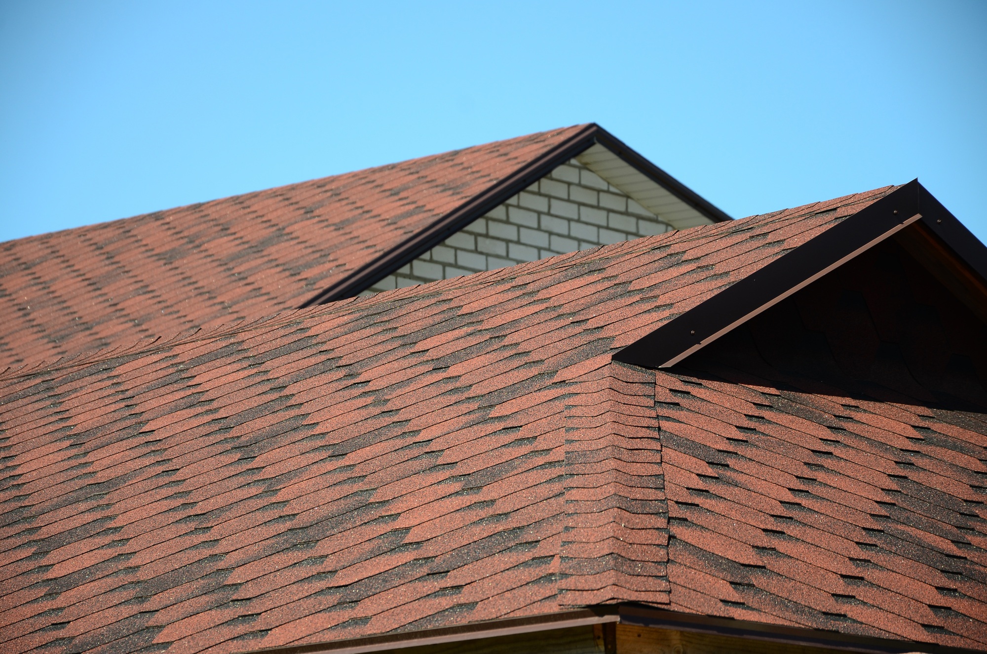 Expert Roofing & Construction installs shingles for high-quality residential roofing.